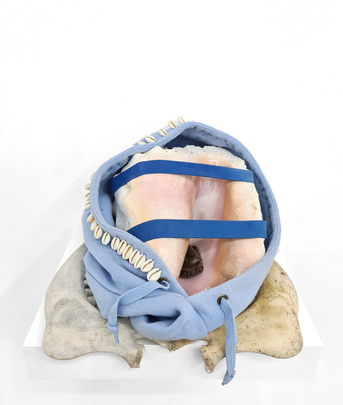 Alberta Whittle, Palaver, 2019 Mixed media with cowrie shells, bronze tongue, cow jaw bones and hoodie, Dimensions variable. Courtesy of the artist and Copperfield.