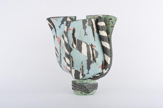Vase with inlaid design and striped fish